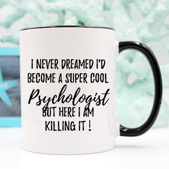 A white ceramic mug featuring a humorous psychologist design, printed on both sides, perfect for coffee or tea.