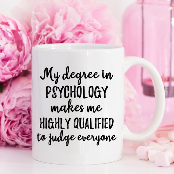 A stylish white psychologist mug featuring a vibrant design printed on both sides, perfect for coffee lovers and psychology enthusiasts.