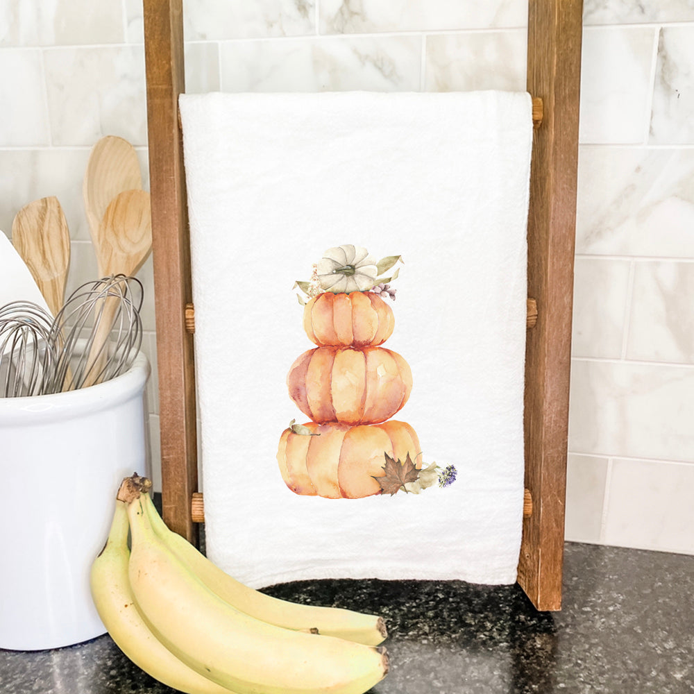 Pumpkin Stack cotton tea towel featuring vibrant pumpkin design on absorbent fabric, perfect for kitchen use.