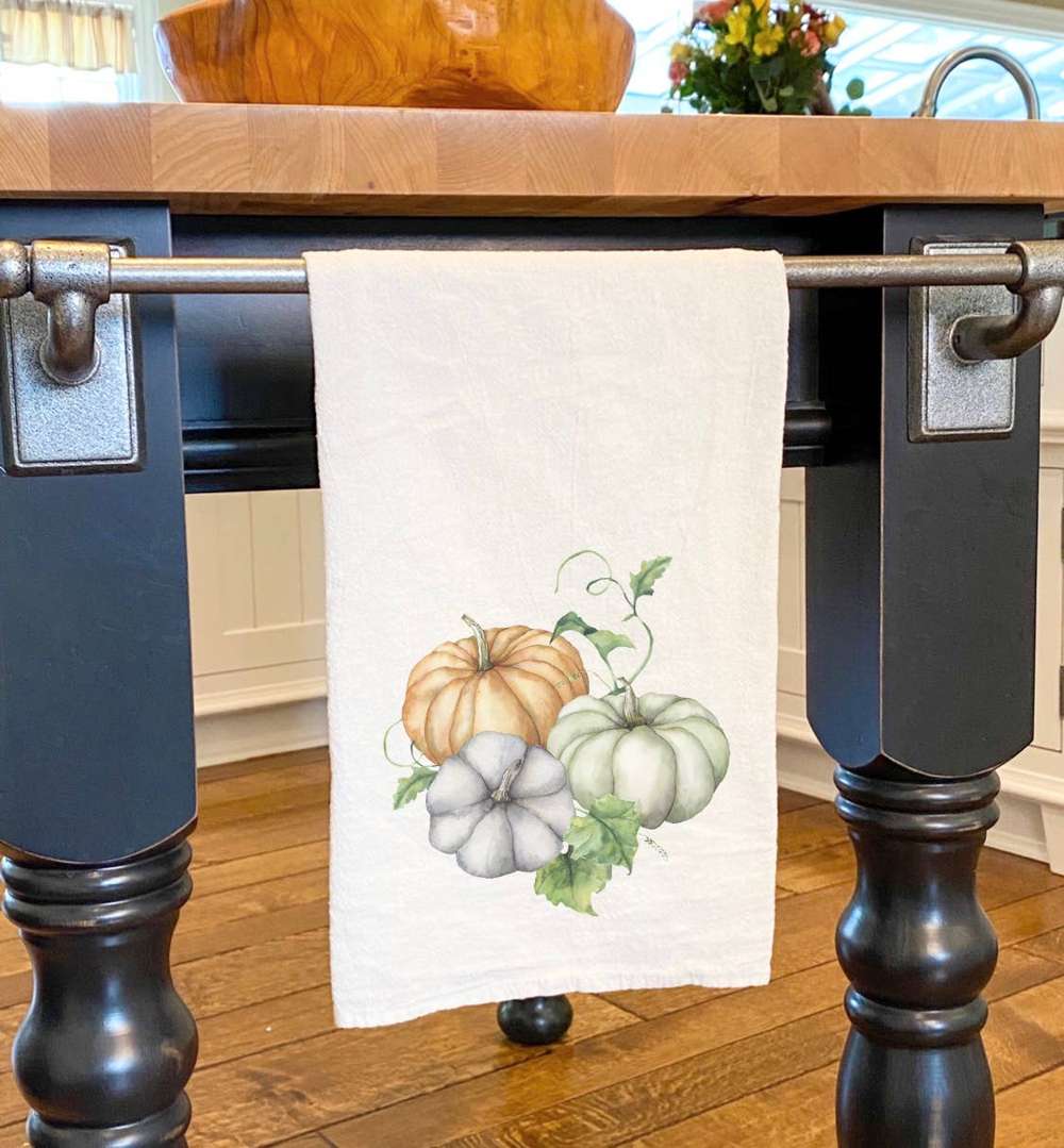 Pumpkins and Leaves Cotton Tea Towel featuring vibrant autumn design, made from 100% absorbent cotton.