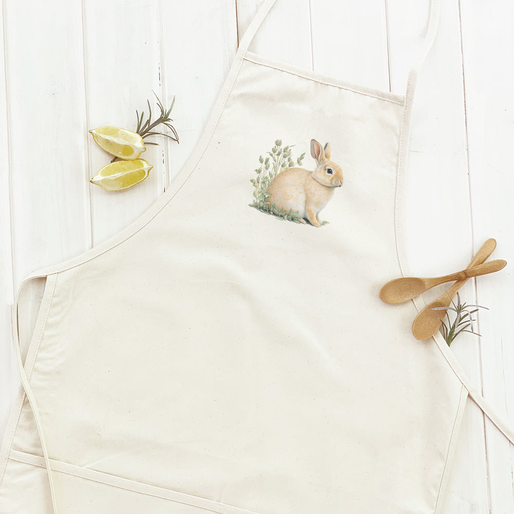 Rabbit in Grass Women's Apron featuring elegant design and divided front pocket, made from durable cotton canvas.