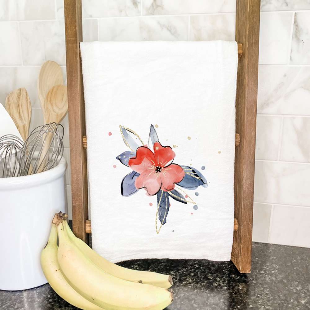 A vibrant red and blue floral cotton tea towel, featuring hemmed edges and a square shape, perfect for kitchen use.