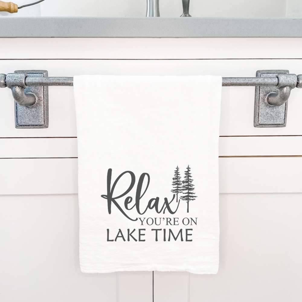 Relax You're on Lake Time cotton tea towel featuring a vibrant lakeside design, perfect for kitchen use.