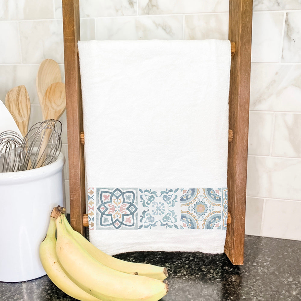 A vibrant cotton tea towel featuring a Row of Talavera Tiles Pattern, showcasing intricate tile designs in bright colors.