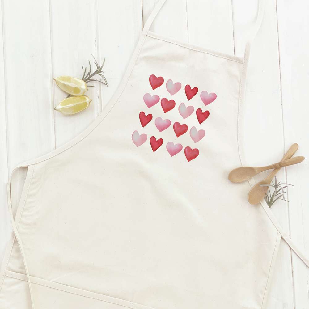 Rows of Hearts Women's Apron featuring elegant design, cotton canvas fabric, and natural twill ties.