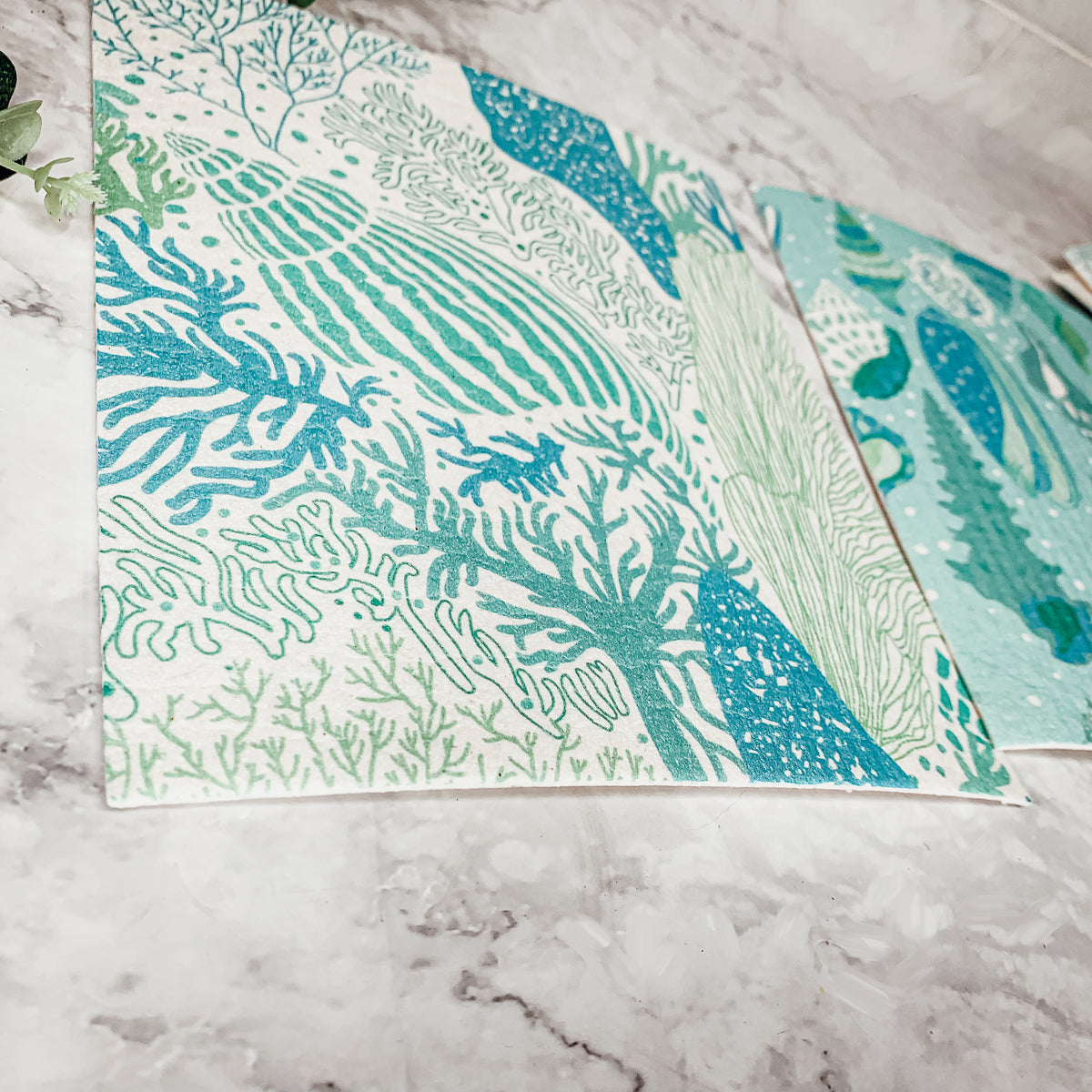 A stylish Sea Biodegradable Cloth featuring coastal designs, made from eco-friendly materials, perfect for kitchen and bathroom cleaning.