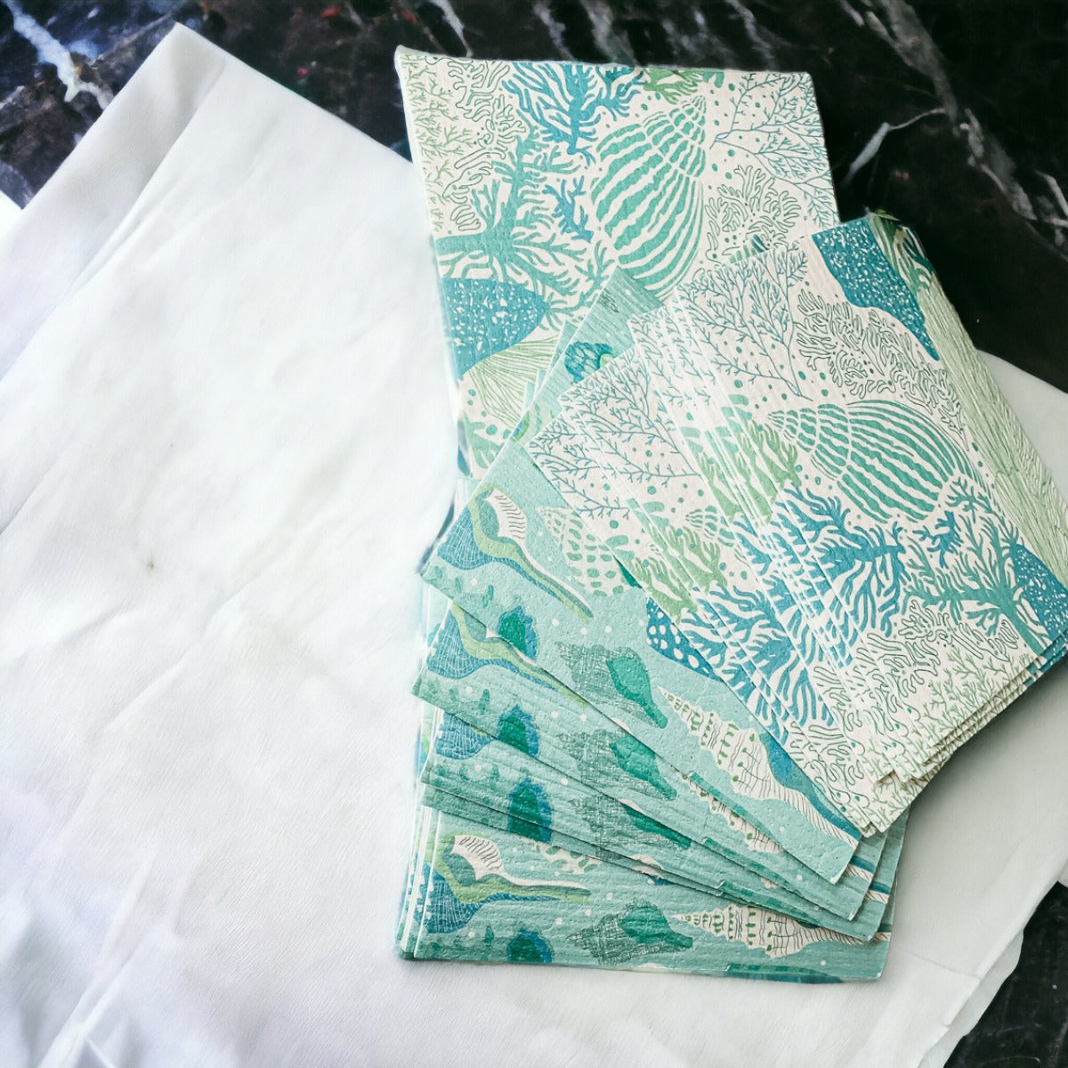 A stylish Sea Biodegradable Cloth featuring coastal designs, made from eco-friendly materials, perfect for kitchen and bathroom cleaning.