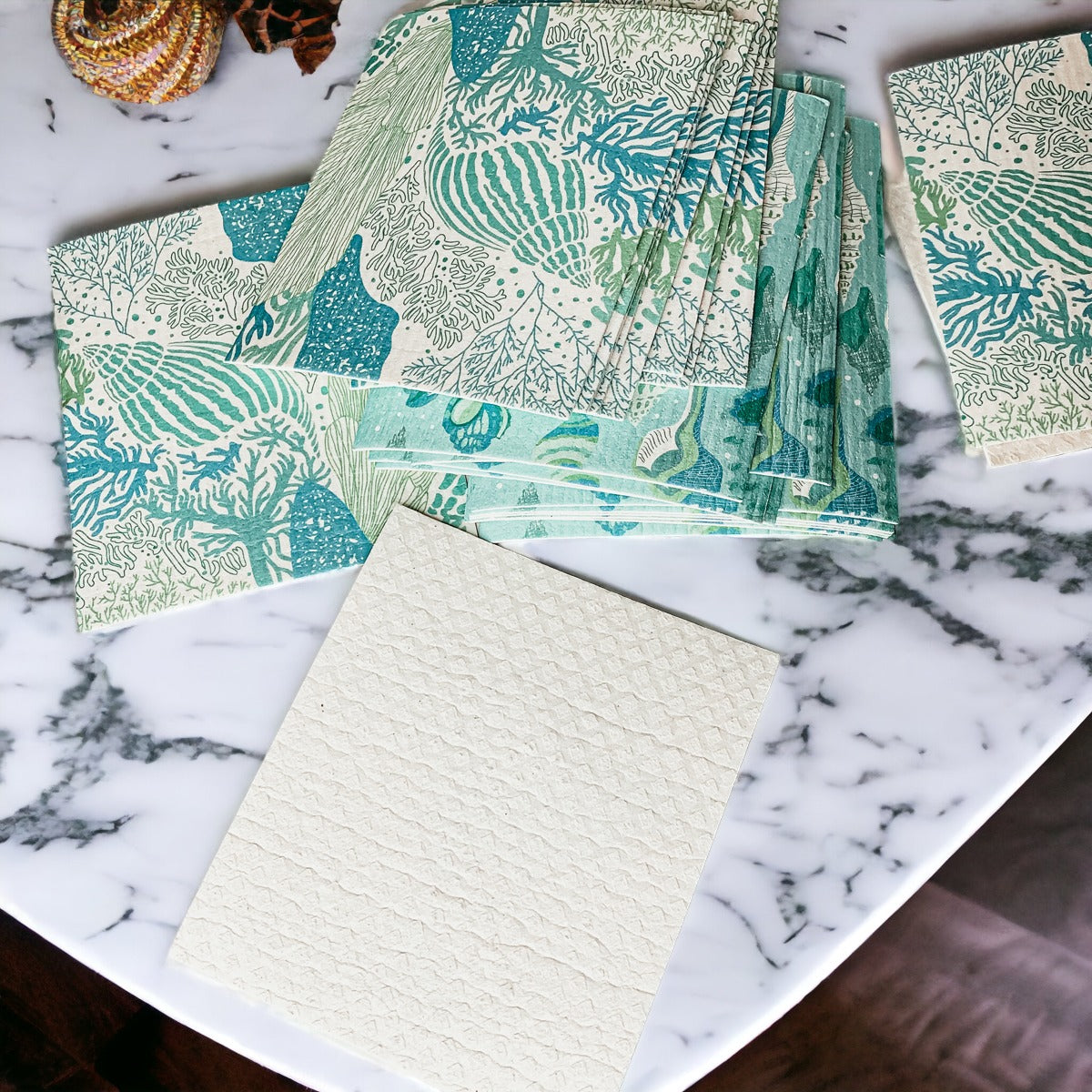 A stylish Sea Biodegradable Cloth featuring coastal designs, made from eco-friendly materials, perfect for kitchen and bathroom cleaning.