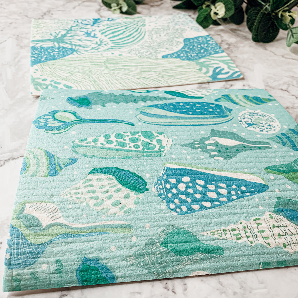 A stylish Sea Biodegradable Cloth featuring coastal designs, made from eco-friendly materials, perfect for kitchen and bathroom cleaning.