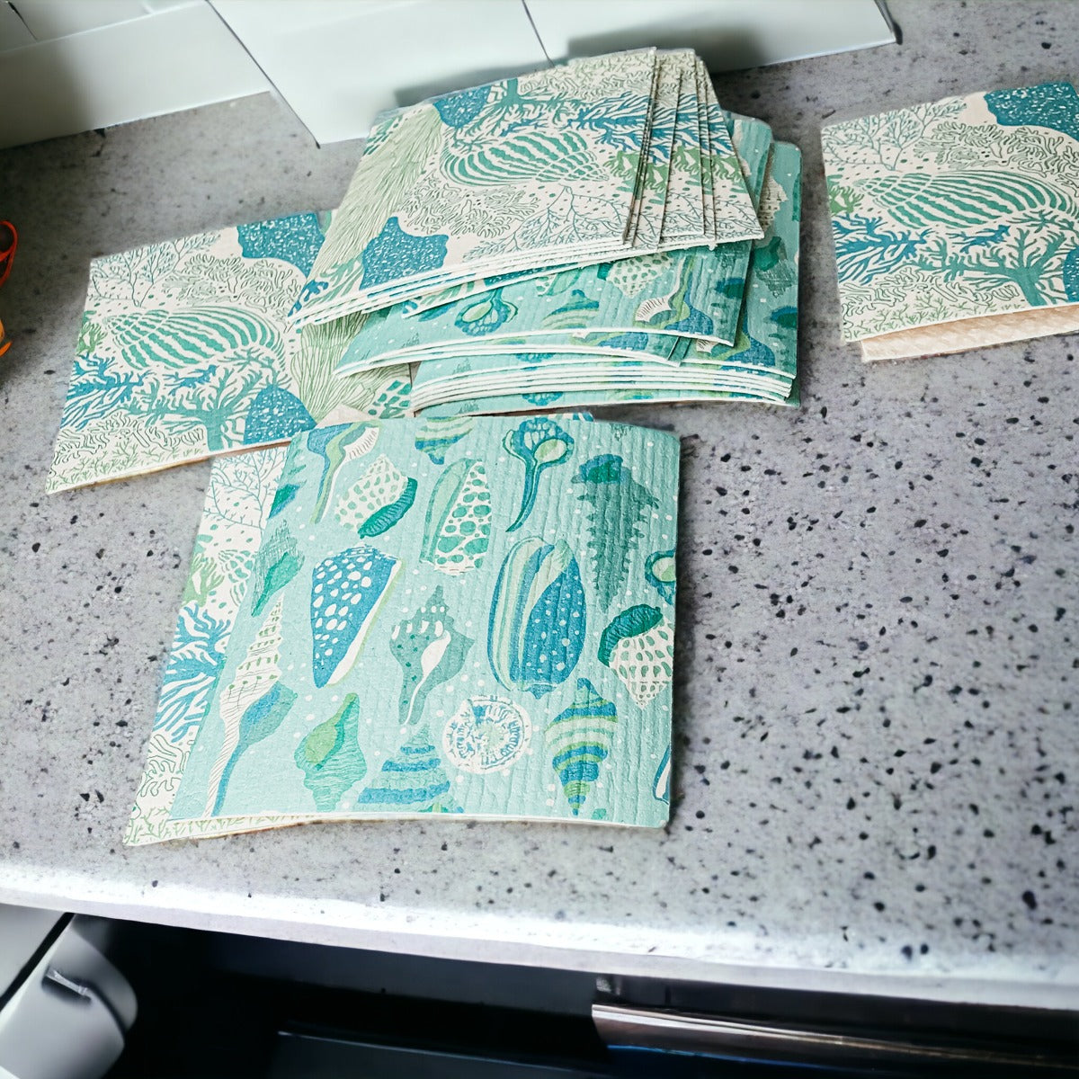 A stylish Sea Biodegradable Cloth featuring coastal designs, made from eco-friendly materials, perfect for kitchen and bathroom cleaning.