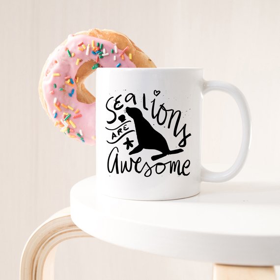 A vibrant coffee mug featuring a playful sea lion design, perfect for coffee lovers and animal enthusiasts.