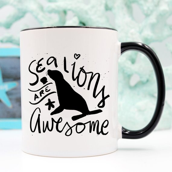 A vibrant coffee mug featuring a playful sea lion design, perfect for coffee lovers and animal enthusiasts.