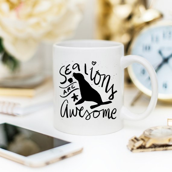 A vibrant coffee mug featuring a playful sea lion design, perfect for coffee lovers and animal enthusiasts.