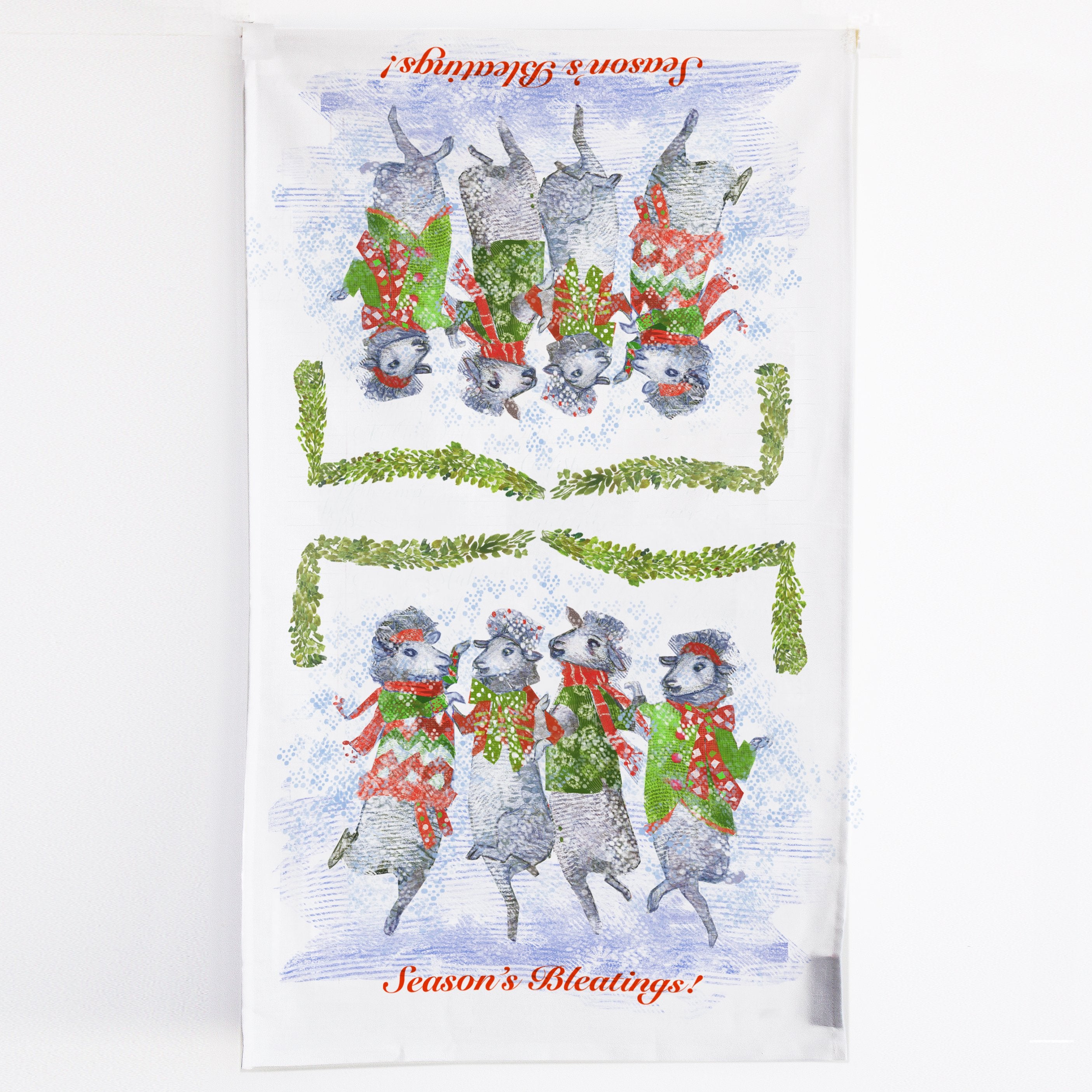 Season's Bleatings Tea Towel featuring five festive sheep in sweaters, made of 100% cotton with a corner loop for hanging.