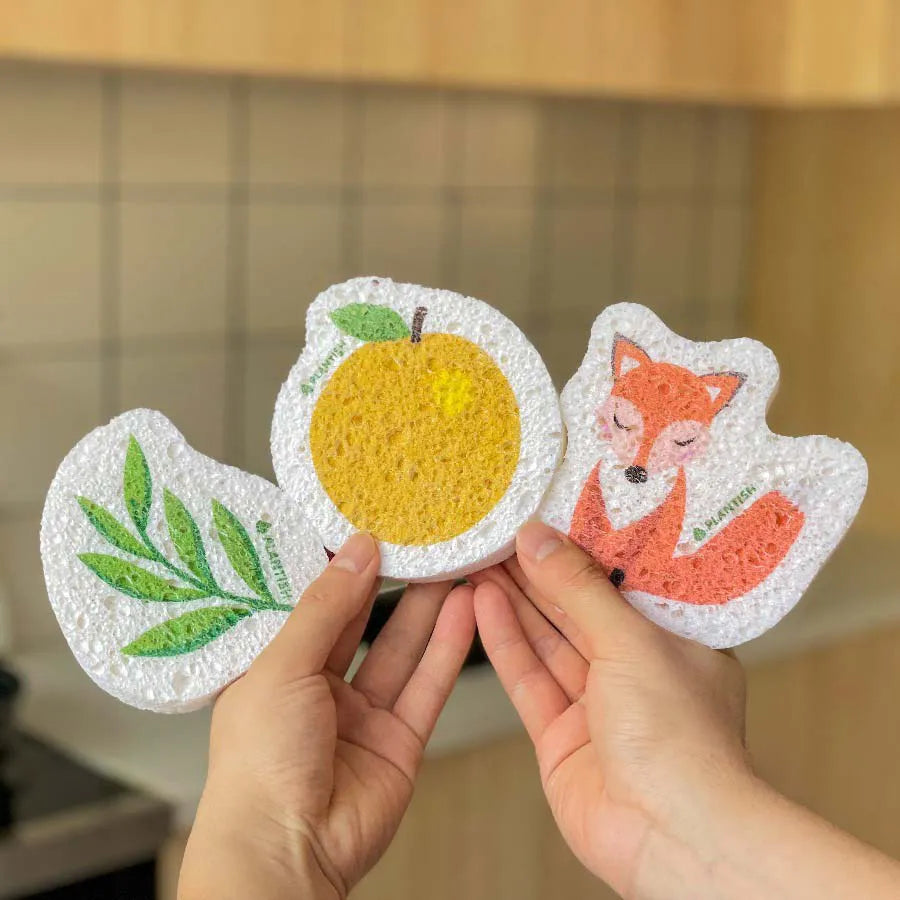 Set of 3 eco-friendly Pop-up Sponges made from vegetable cellulose, showcasing their natural texture and compostable design.