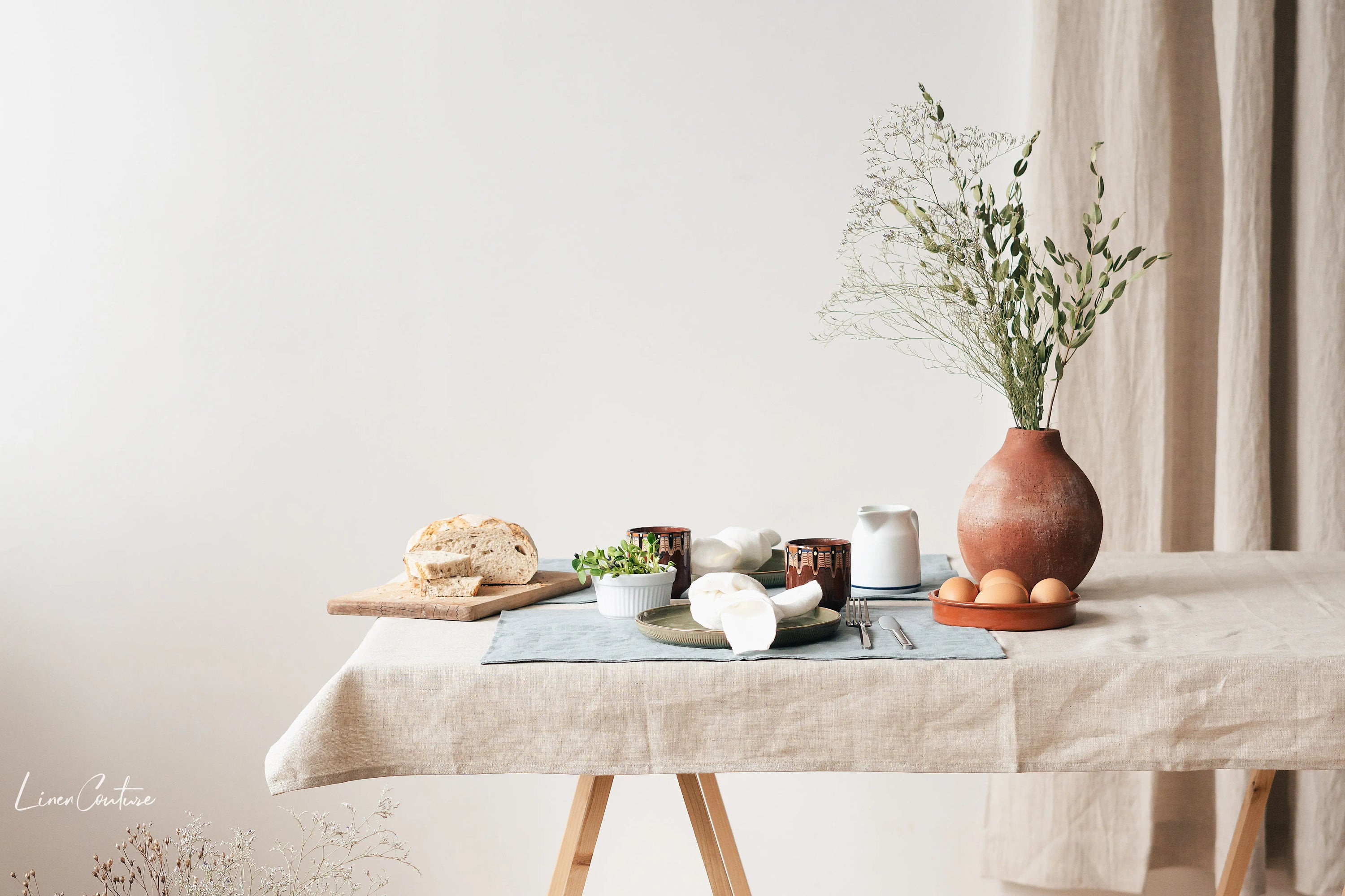 Set of two natural linen coasters in various colors, perfect for protecting tables from hot and cold beverages.