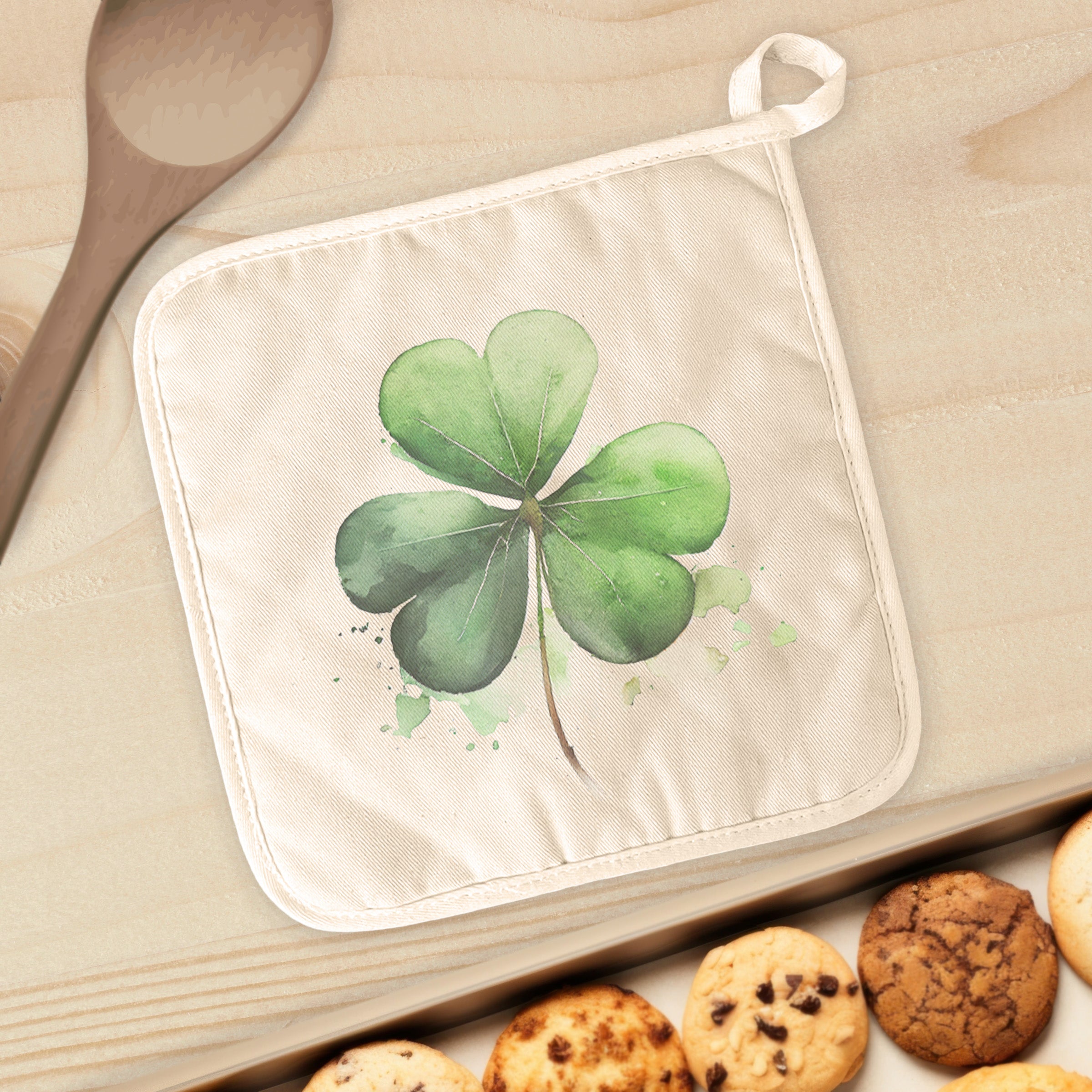 Shamrock Cotton Pot Holder featuring vibrant designs and a convenient hanging loop, perfect for kitchen use.