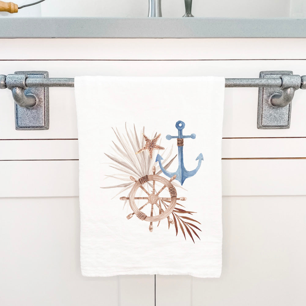 A beautifully designed cotton tea towel featuring a ship wheel anchor motif, perfect for kitchen use.