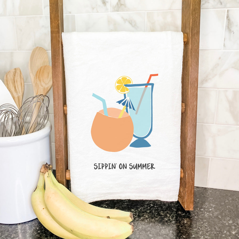 Sippin' on Summer cotton tea towel featuring vibrant summer-themed designs, hemmed edges, and a flour sack style, perfect for kitchen use.