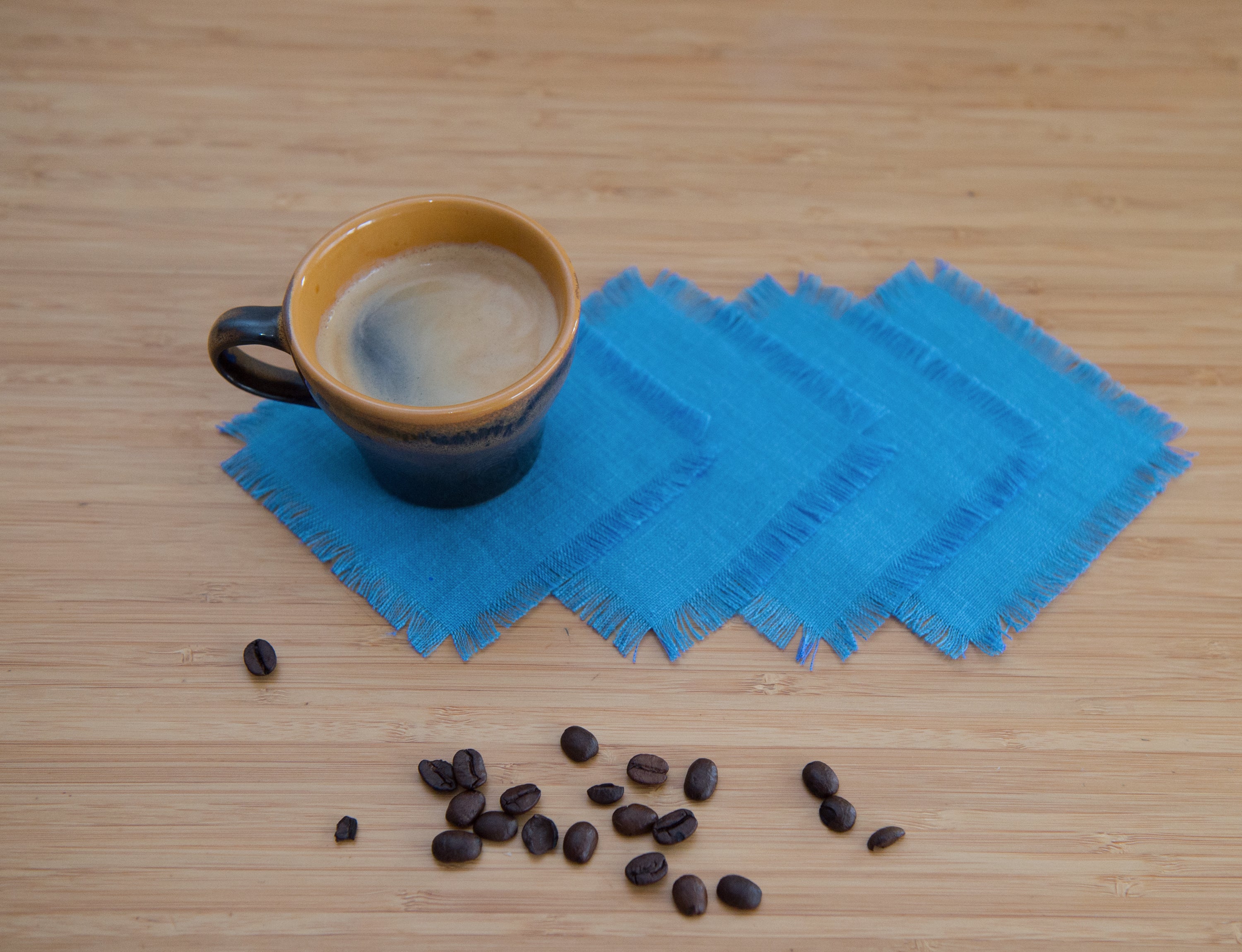 Sky Blue linen coasters set with tassels, showcasing elegant design and natural fabric.