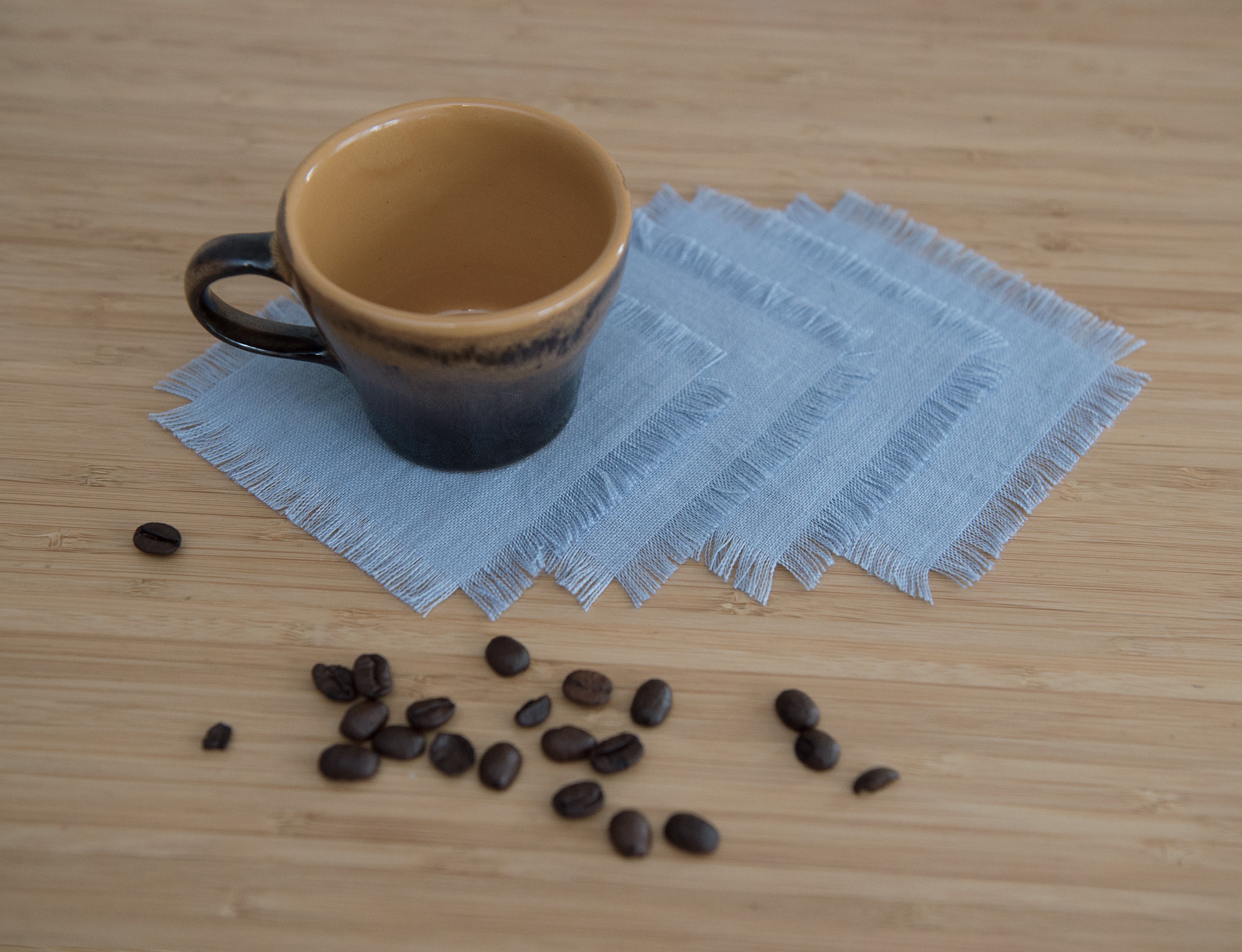 Sky Blue linen coasters set with tassels, showcasing elegant design and natural fabric.