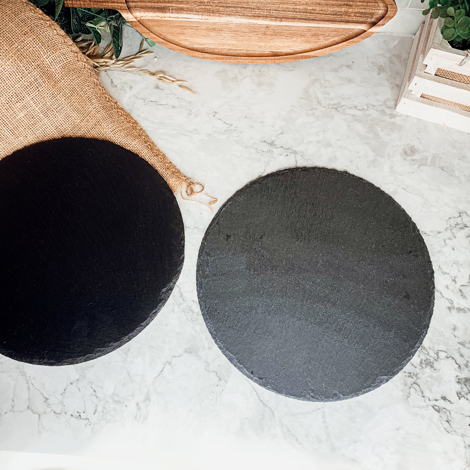 11-inch round slate cheese board with natural edges, perfect for serving appetizers and cheeses.