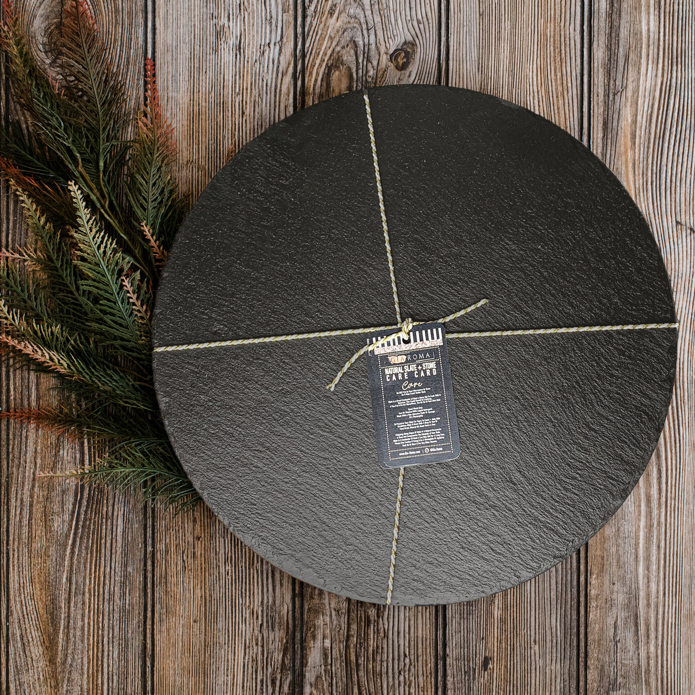 11-inch round slate cheese board with natural edges, perfect for serving appetizers and cheeses.