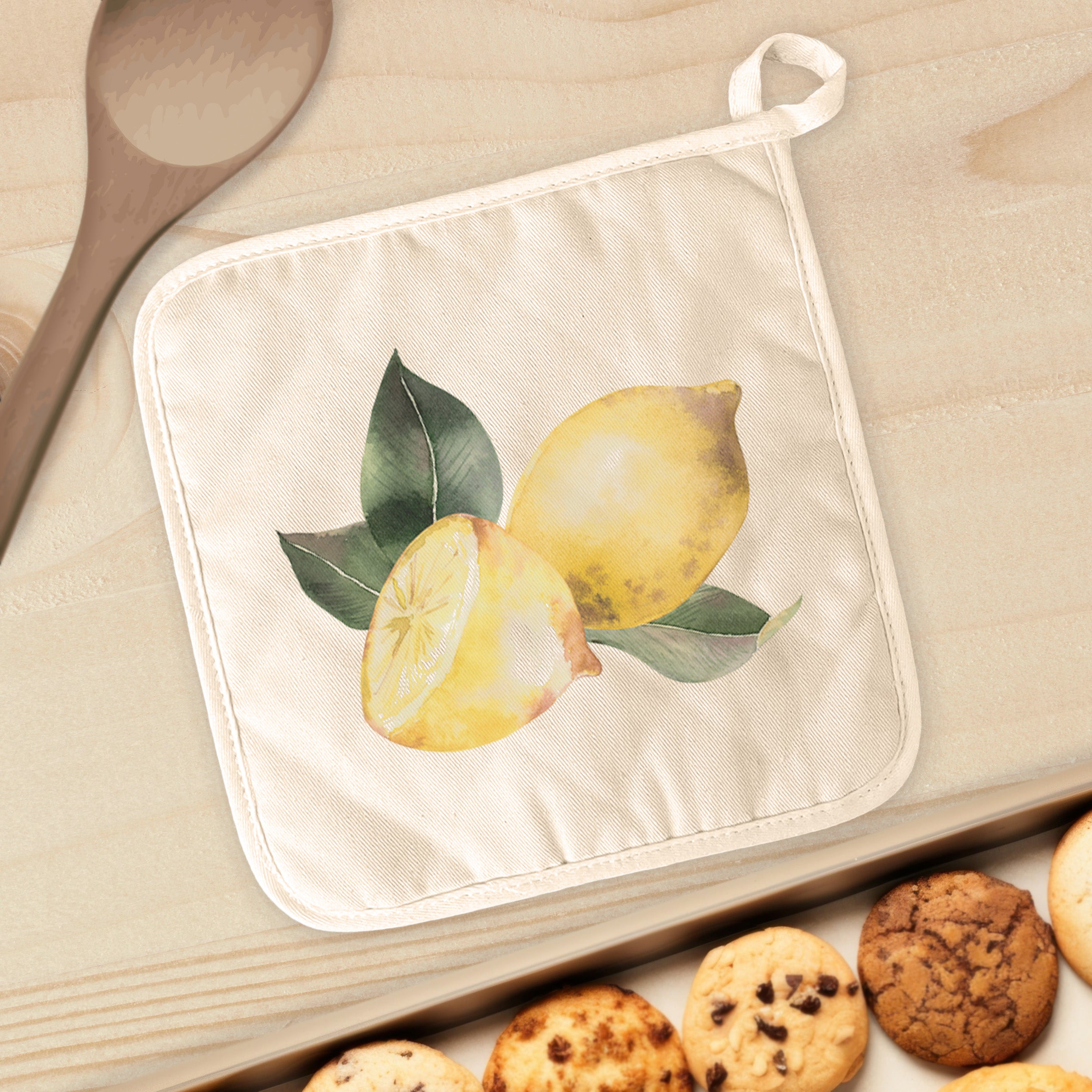 Sliced Lemon Cotton Pot Holder featuring vibrant lemon design, quilted terry cloth, and convenient hanging loop.