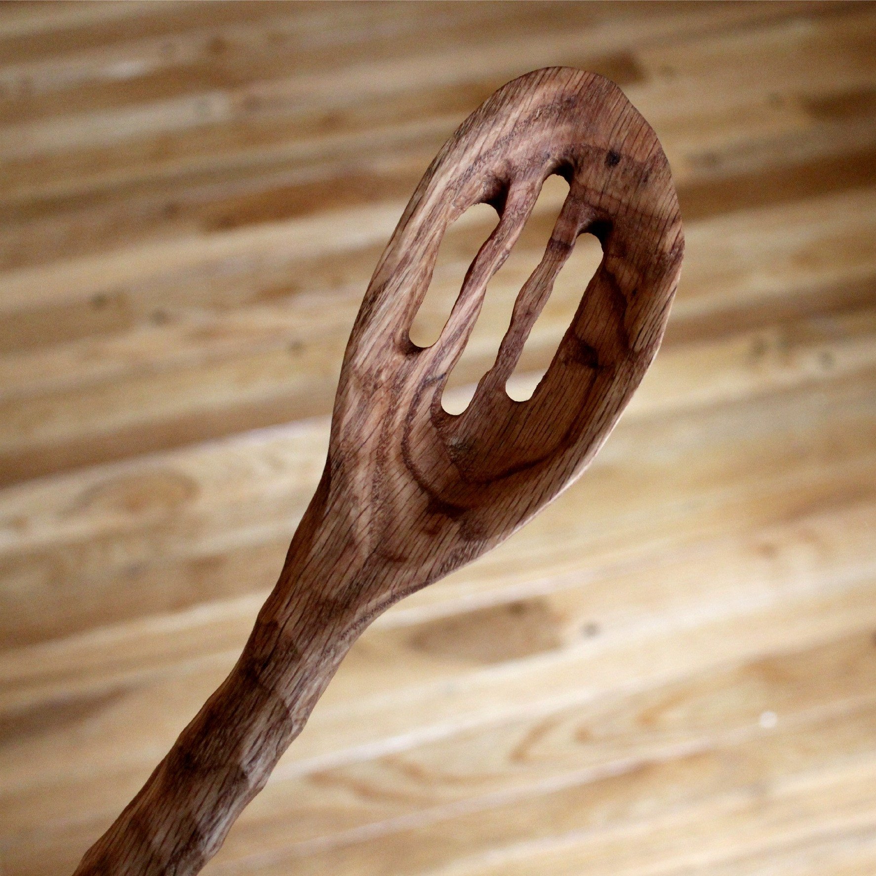 A beautifully crafted Slotted Chef Spoon made from urban lumber, featuring three slots and a natural olive oil finish.