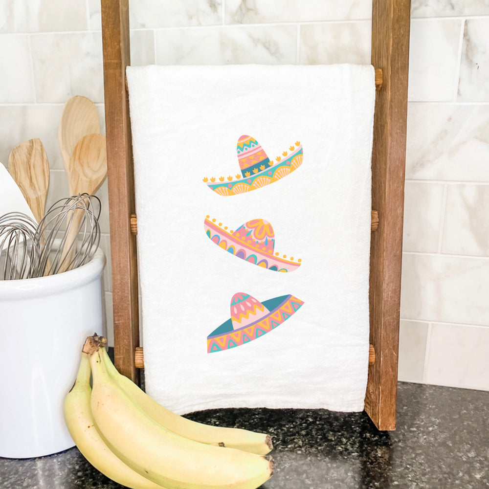 A vibrant cotton tea towel featuring a colorful sombrero design, perfect for kitchen use.