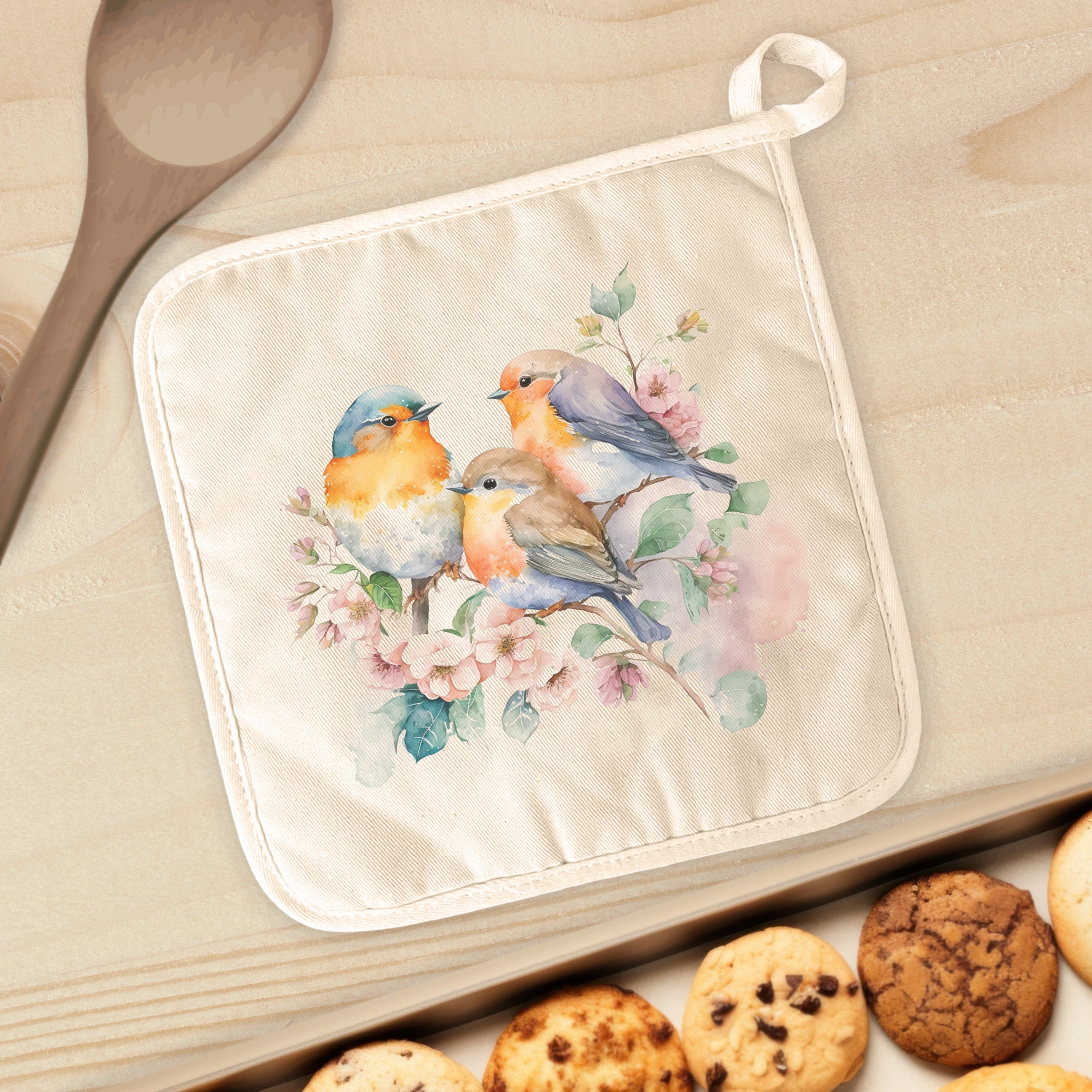 A vibrant Spring Birds Watercolor cotton pot holder featuring colorful bird designs on a natural-color background, perfect for kitchen use.