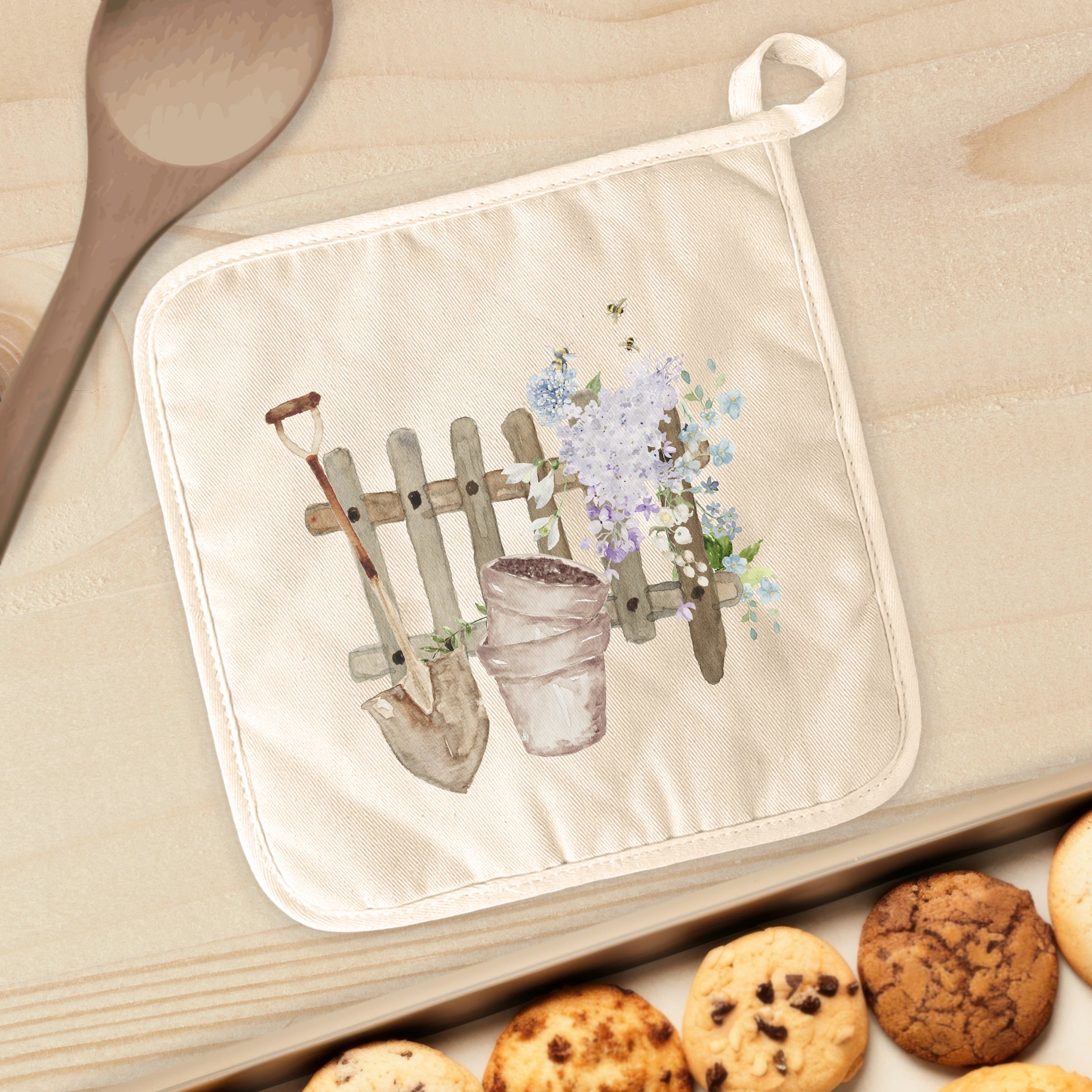 A vibrant Spring Planting Cotton Pot Holder featuring a square design, made from natural cotton and quilted terry cloth, ideal for protecting surfaces from hot cookware.