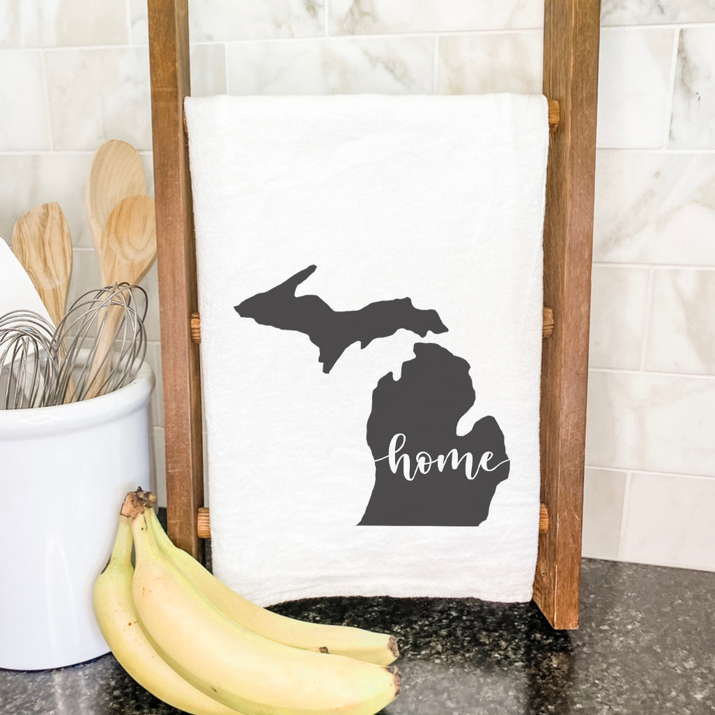 A vibrant cotton tea towel featuring state-themed designs, perfect for kitchen use.