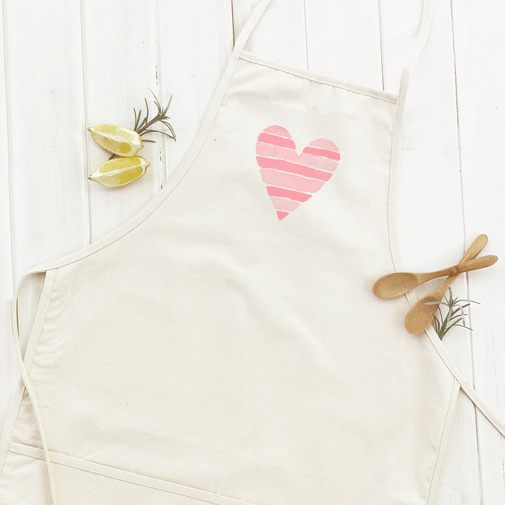 Striped Heart Women's Apron featuring a stylish design with natural twill ties and a divided front pocket, made from durable cotton canvas.