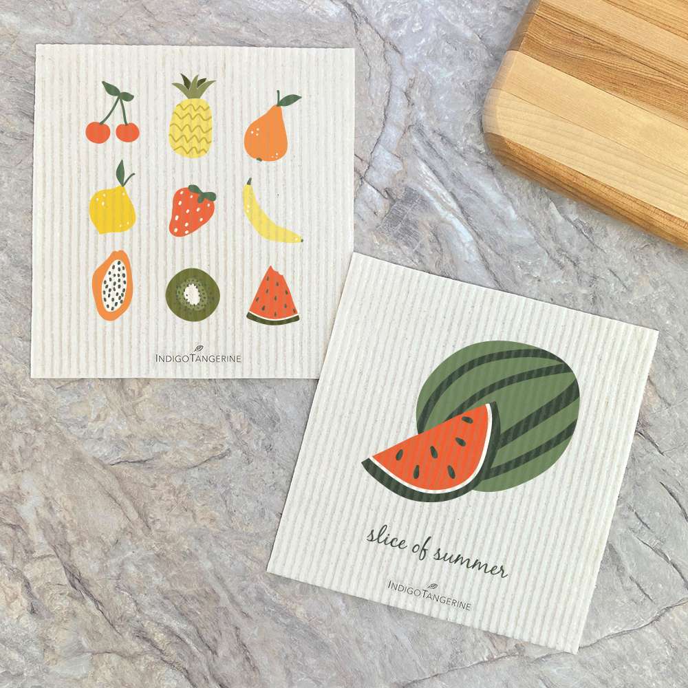 Two Swedish dish cloths featuring vibrant summer fruit designs, made from eco-friendly materials.