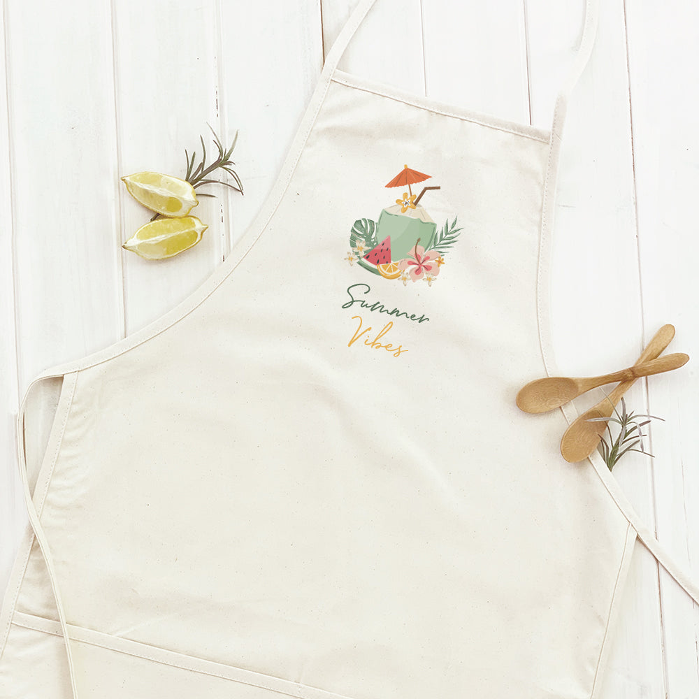 A stylish women's apron featuring a summer coconut drink design, made from durable cotton canvas with adjustable neck and twill ties.