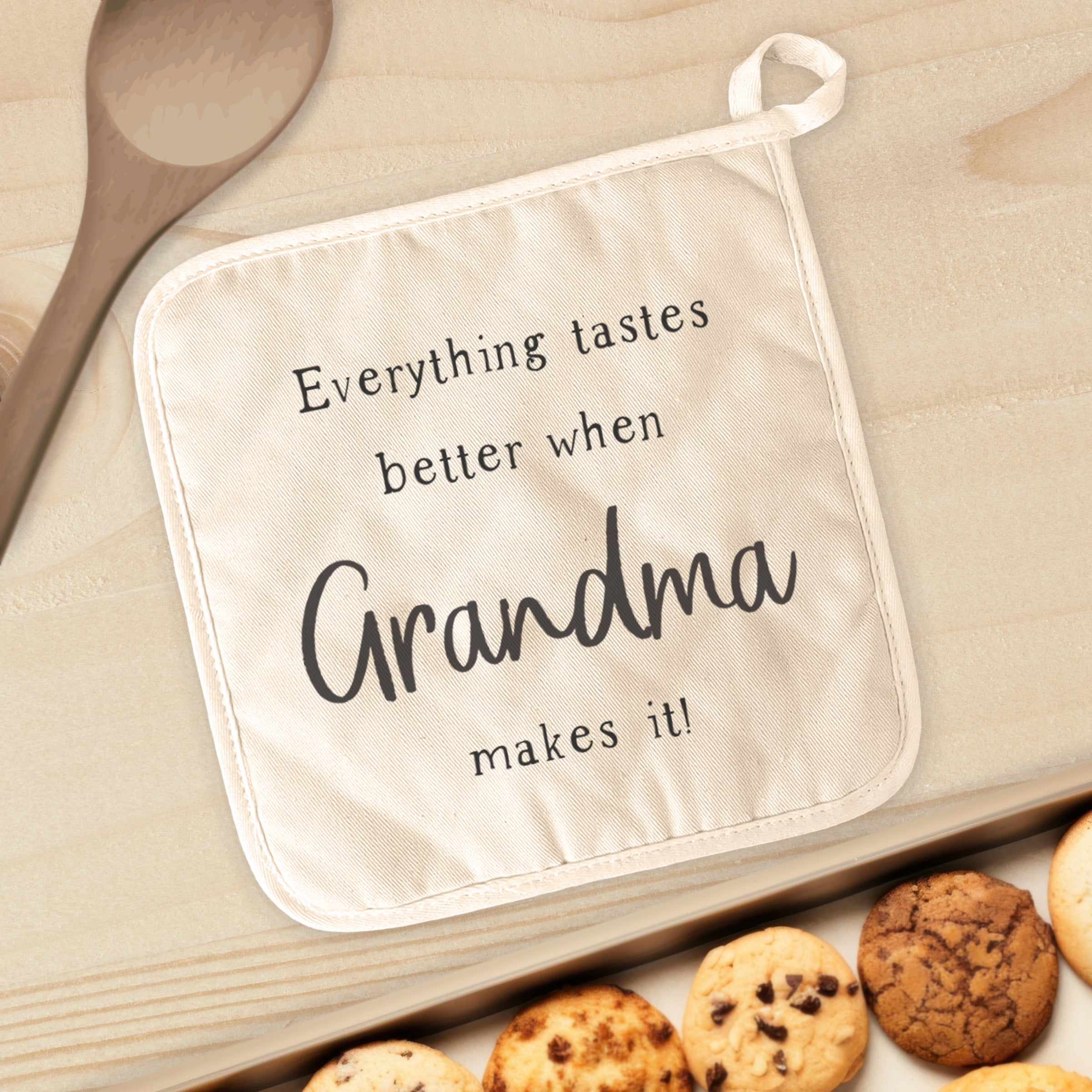 Taste Better Grandma Cotton Pot Holder featuring vibrant designs and a convenient hanging loop, perfect for kitchen use.