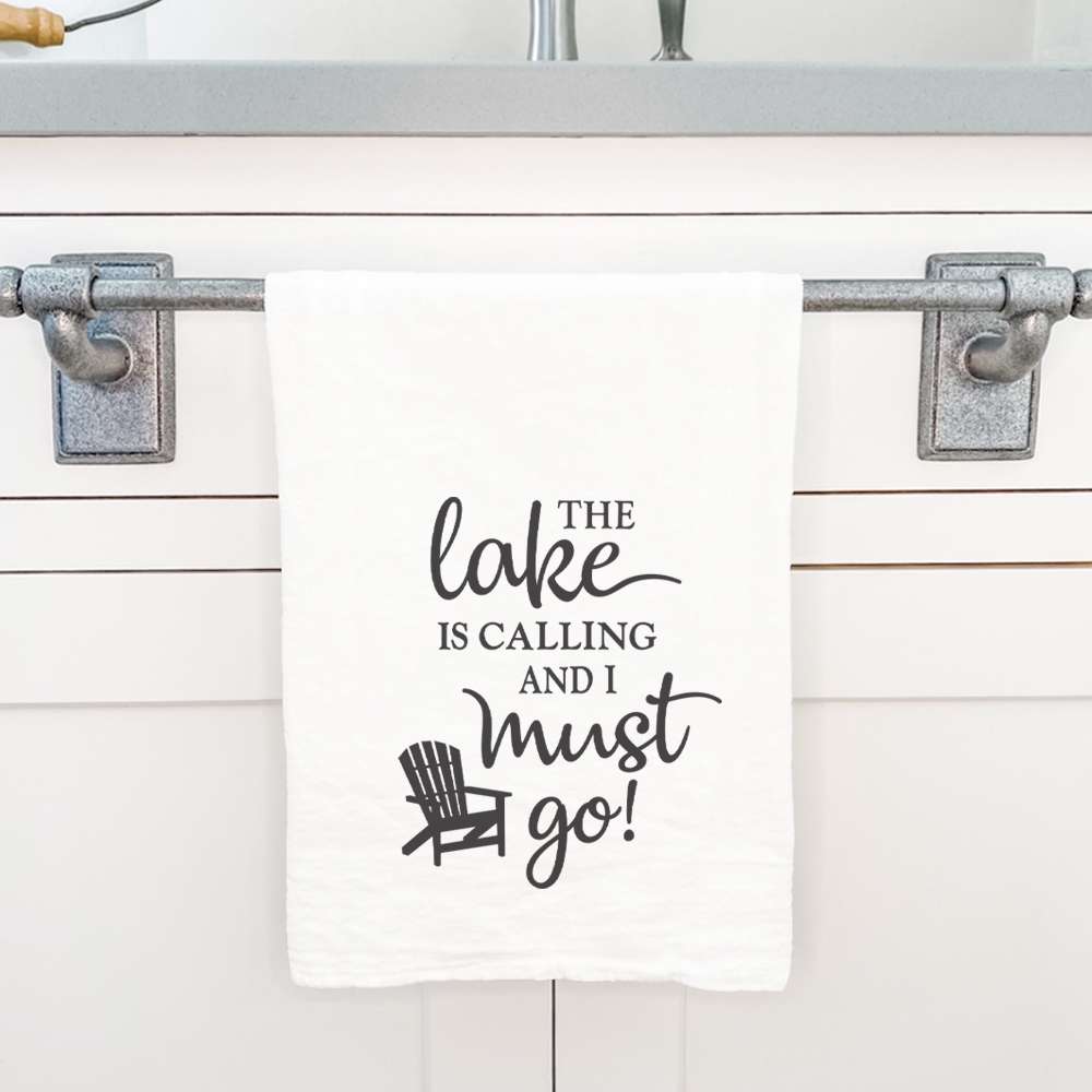 The Lake is Calling cotton tea towel featuring vibrant water-based ink design, perfect for kitchen use.