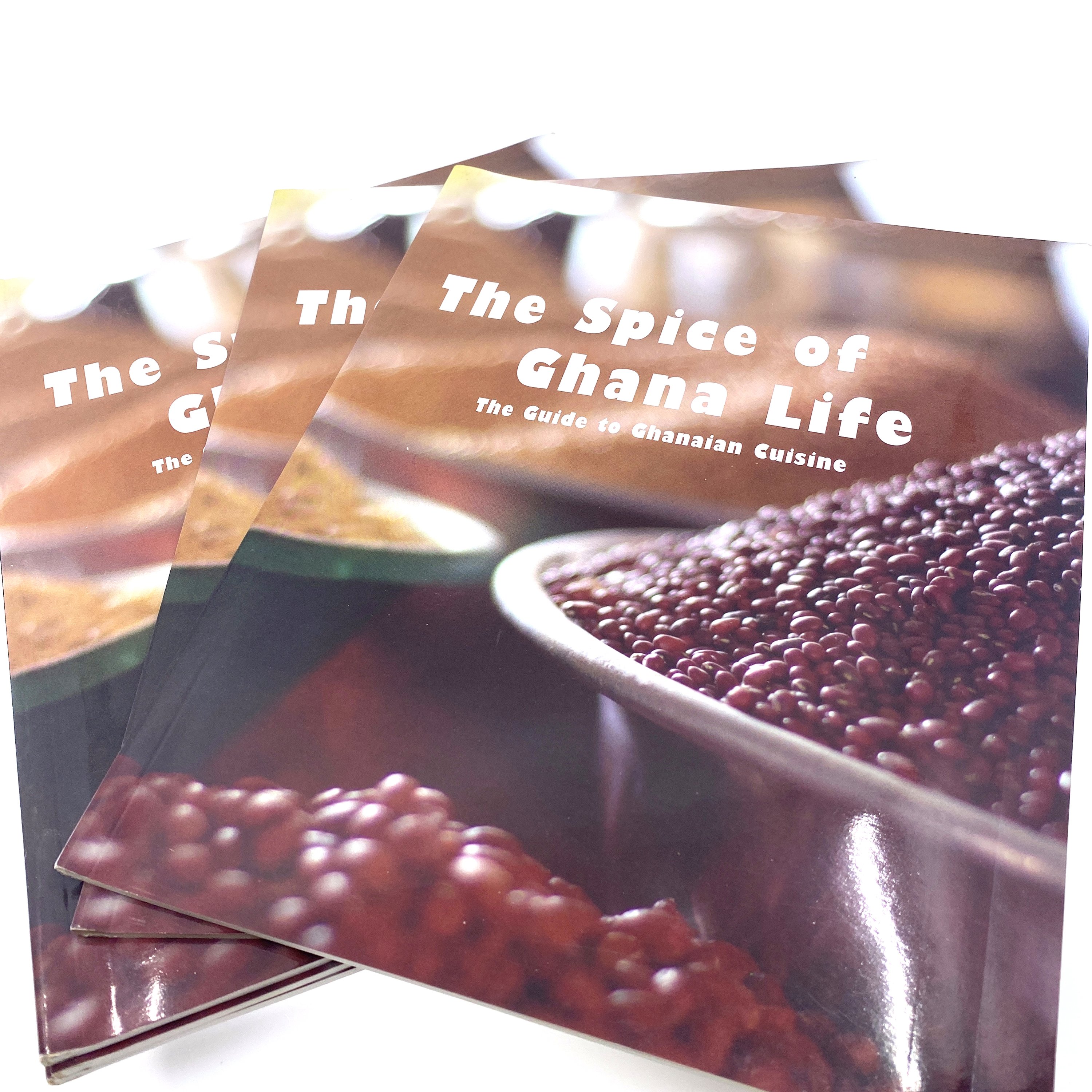 Cover of 'The Spice of Ghana Life' cookbook featuring vibrant Ghanaian dishes and traditional recipes.