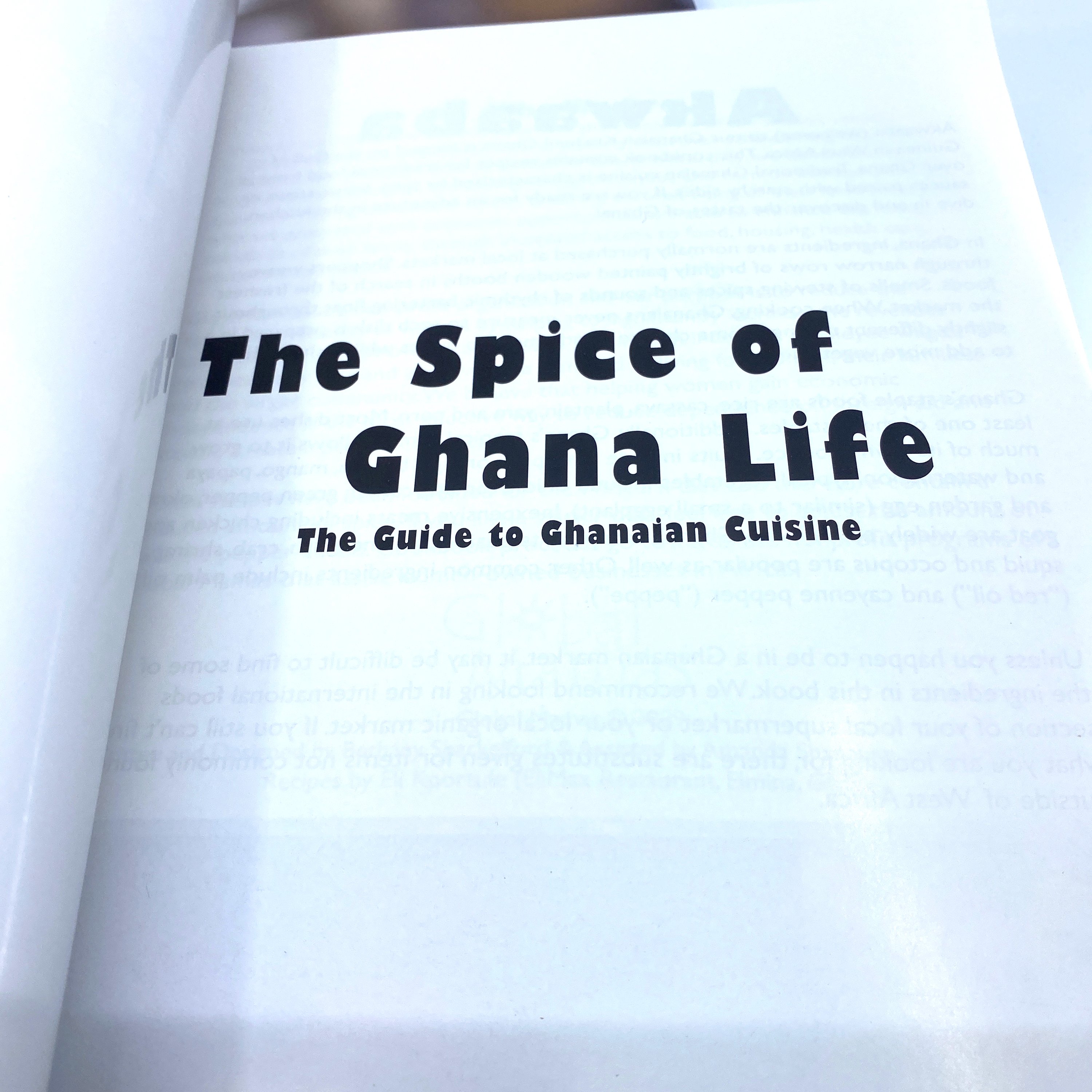 Cover of 'The Spice of Ghana Life' cookbook featuring vibrant Ghanaian dishes and traditional recipes.