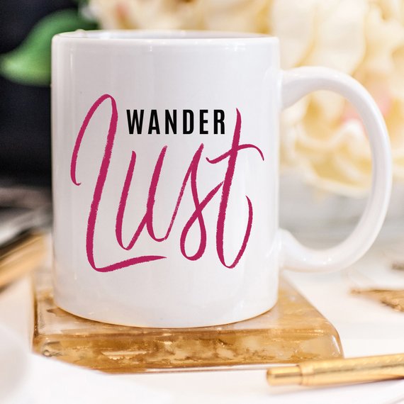 A whimsical 'Wanderlust' coffee mug featuring a funny design, perfect for adventure lovers, made from high-grade ceramic.