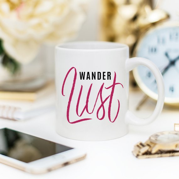 A whimsical 'Wanderlust' coffee mug featuring a funny design, perfect for adventure lovers, made from high-grade ceramic.