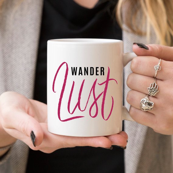 A whimsical 'Wanderlust' coffee mug featuring a funny design, perfect for adventure lovers, made from high-grade ceramic.