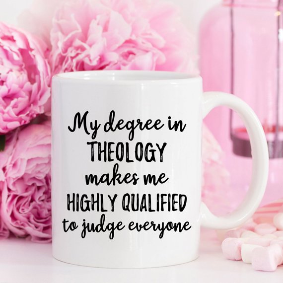 A white ceramic Theology Mug featuring a vibrant design printed on both sides, ideal for coffee or tea lovers.