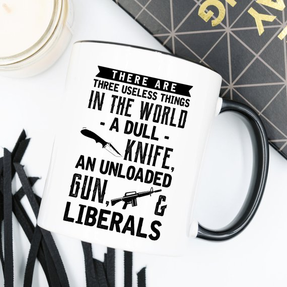 Funny coffee mug featuring the phrase 'There Are Three Useless Things In The World, A Dull Knife, Unloaded Gun & Liberal', crafted from high-quality ceramic.