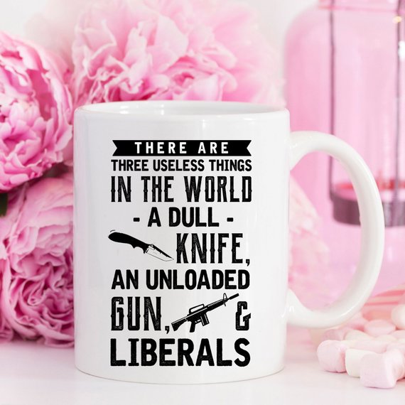 Funny coffee mug featuring the phrase 'There Are Three Useless Things In The World, A Dull Knife, Unloaded Gun & Liberal', crafted from high-quality ceramic.