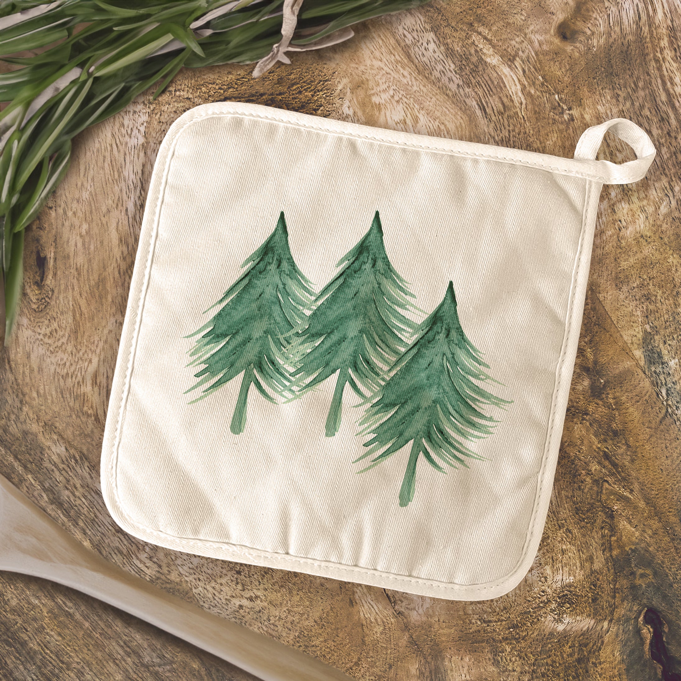 Three Trees Cotton Pot Holder in natural color with vibrant prints, featuring a convenient hanging loop.