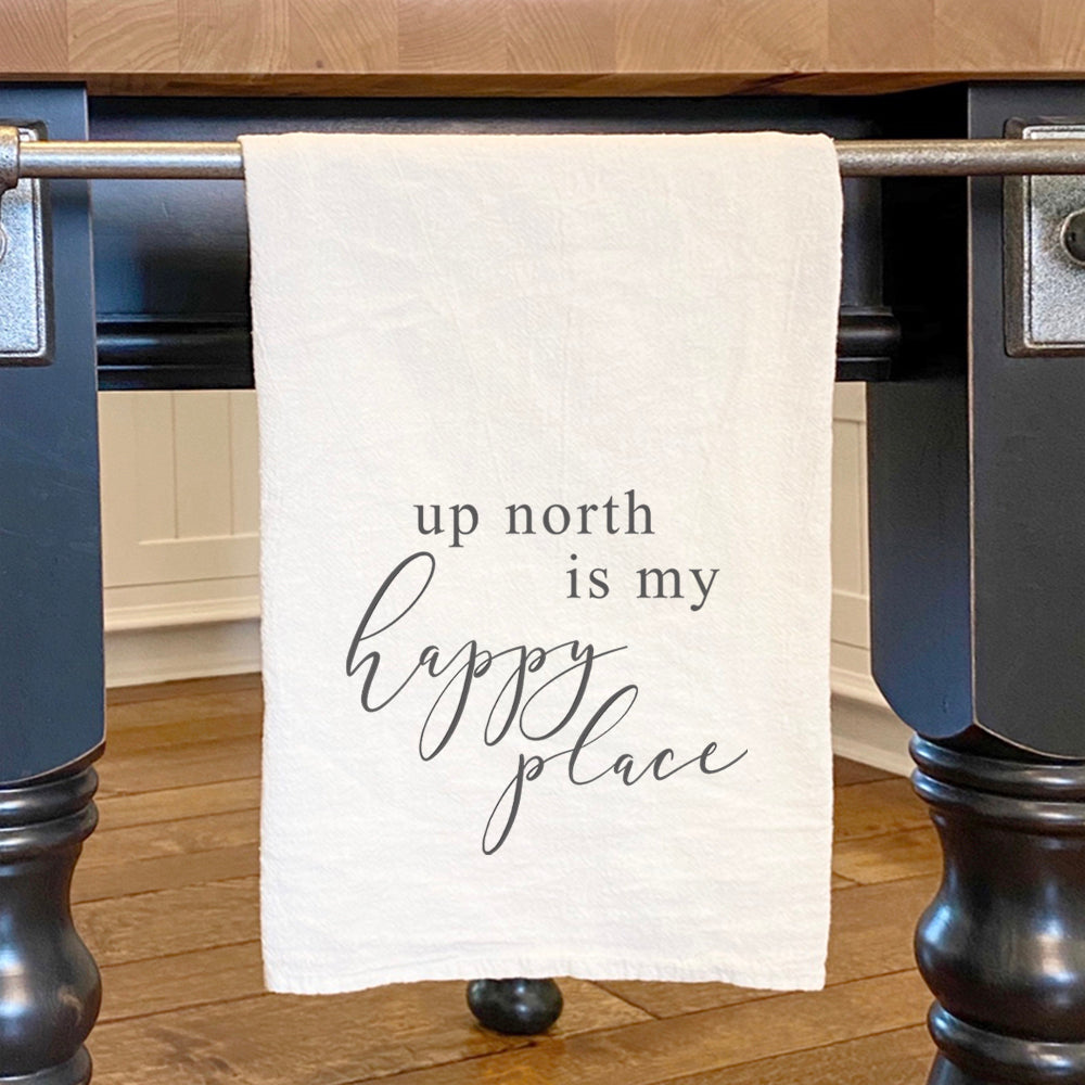 Up North Is My Happy Place cotton tea towel featuring vibrant design and hemmed edges, perfect for kitchen use.