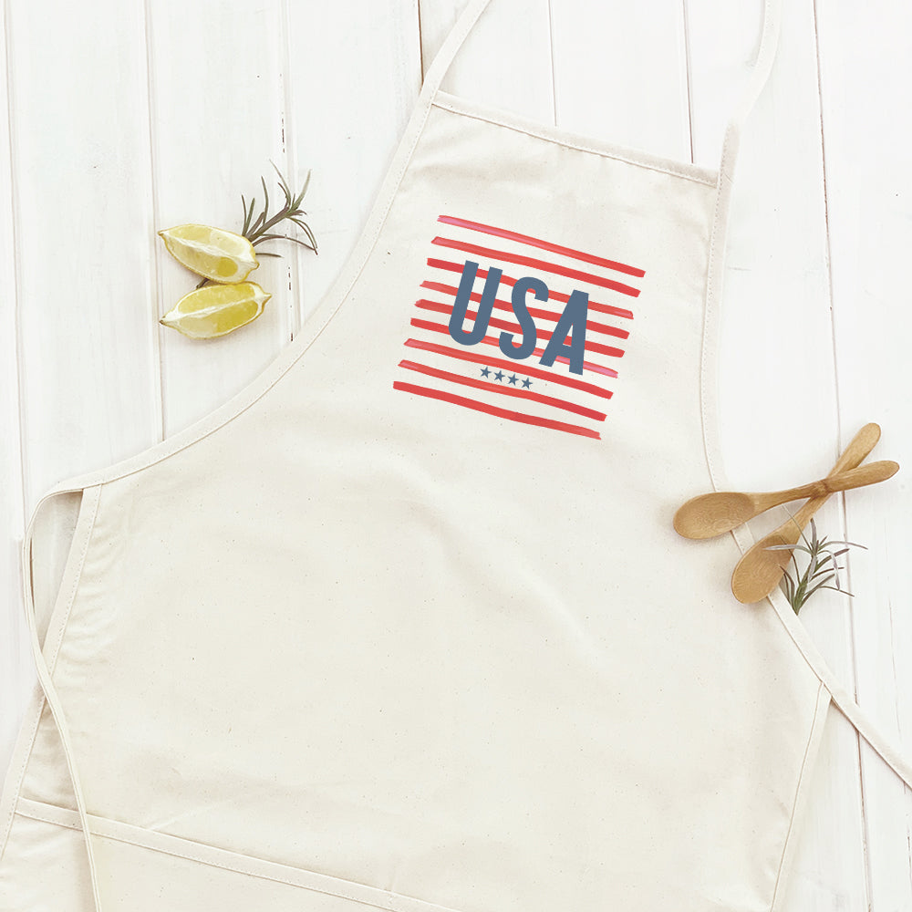 USA Women's Apron made of cotton canvas with natural twill ties, featuring a divided front pocket and elegant design.