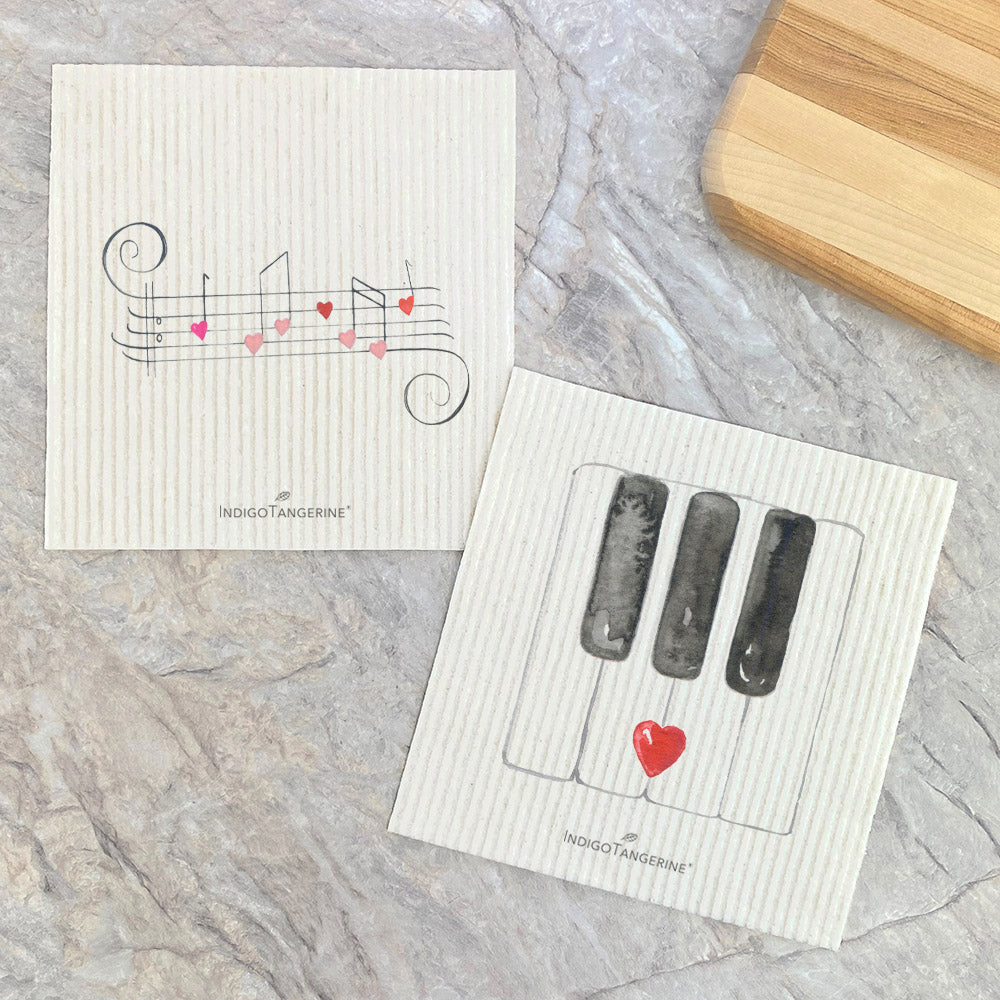 Two Swedish dishcloths featuring Valentine's Music and Piano Keys design, eco-friendly and reusable.